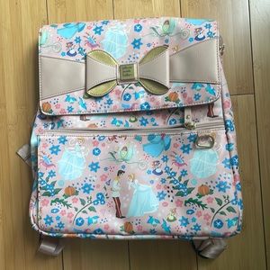 This is a pink cinderella diaper bag.